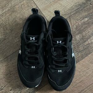 Black Under Armour with the white Logo Also in the front and side